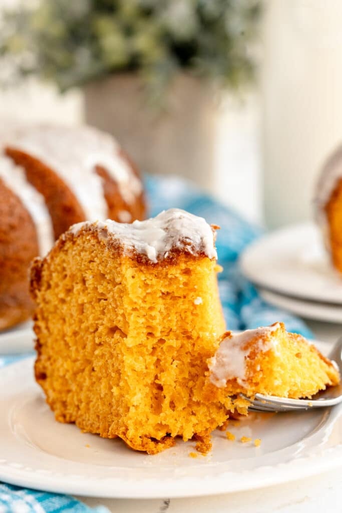 slice of butterscotch cake with a bite on a fork.