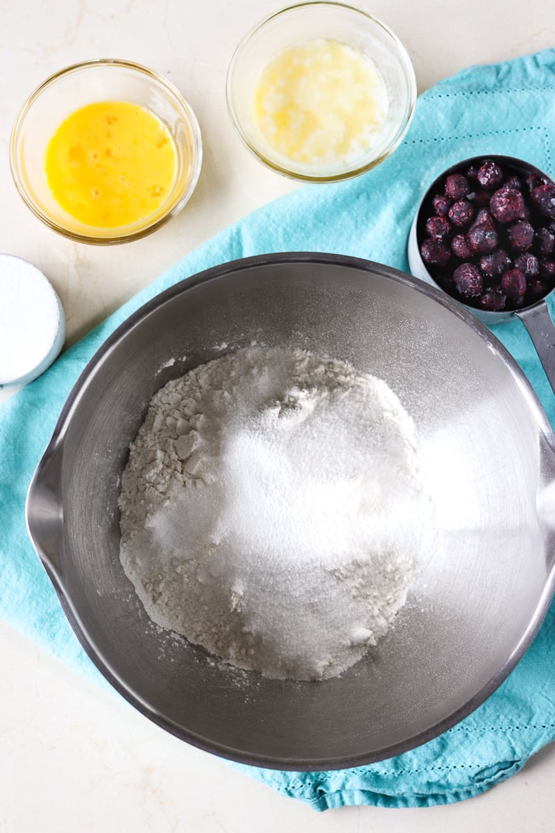 mixing bowl with ingredients for blueberry muffins
