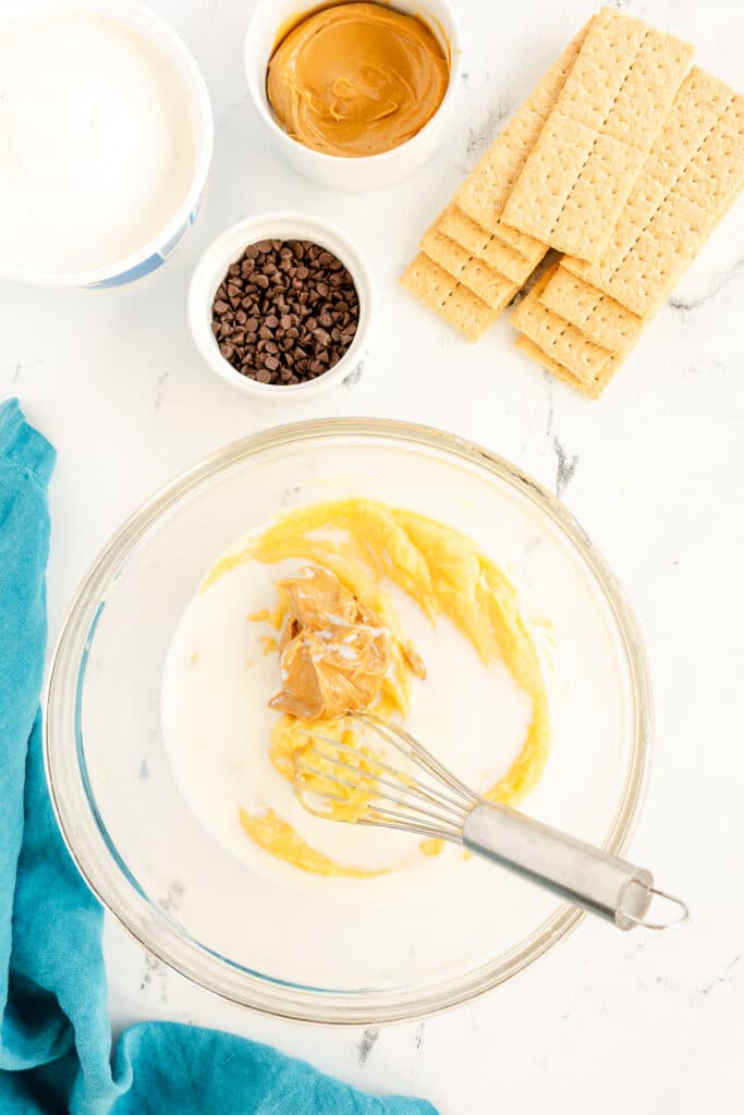 instant vanilla pudding with peanut butter in a mixing bowl.