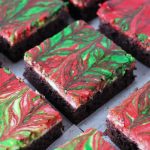 sliced red & green swirled cheesecake brownies
