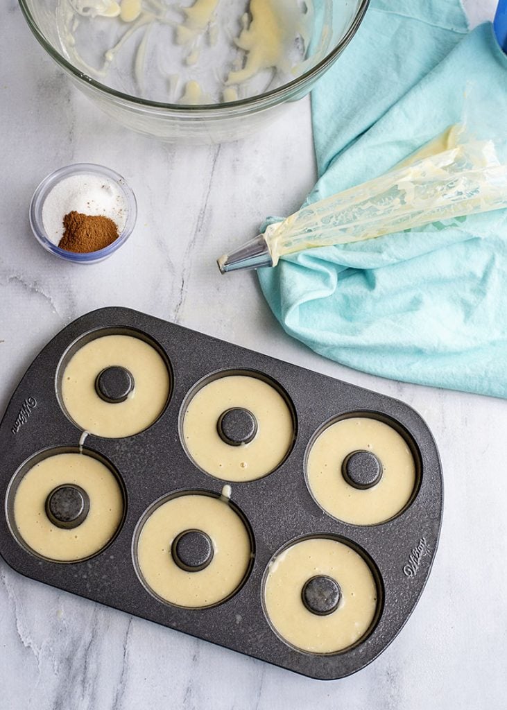 overhead shot of batter in donut baking pan