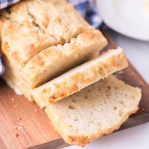 loaf of sliced beer bread on a cutting board