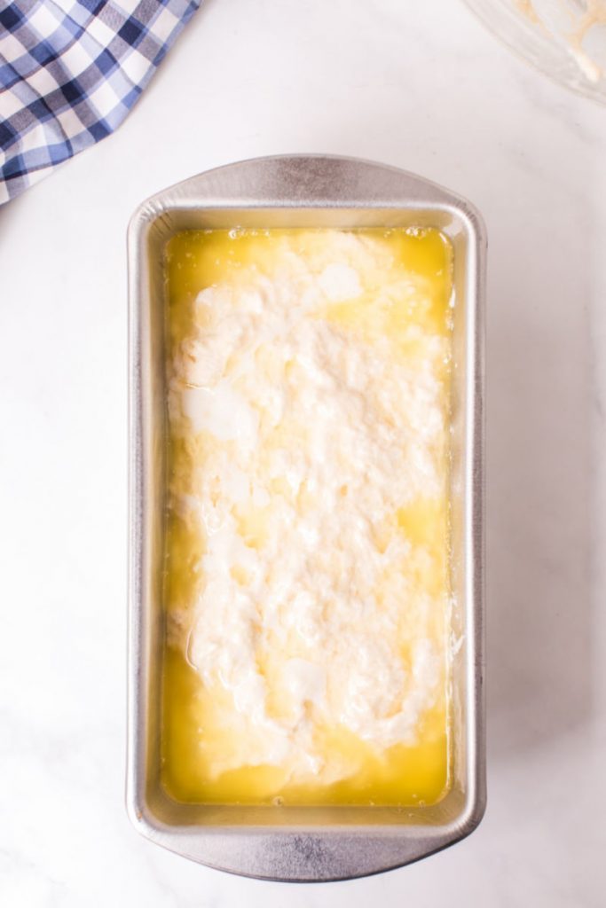 beer bread batter with melted butter poured over it