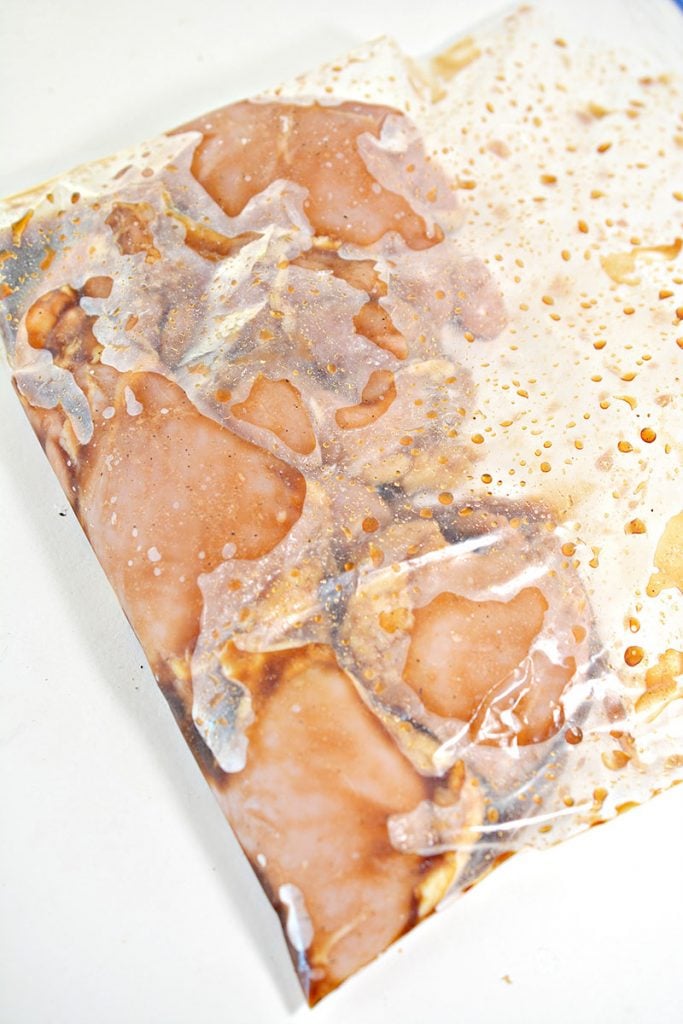 chicken thighs in freezer bag of marinade