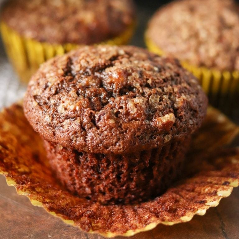 single chocolate banana muffin sitting in wrapper.