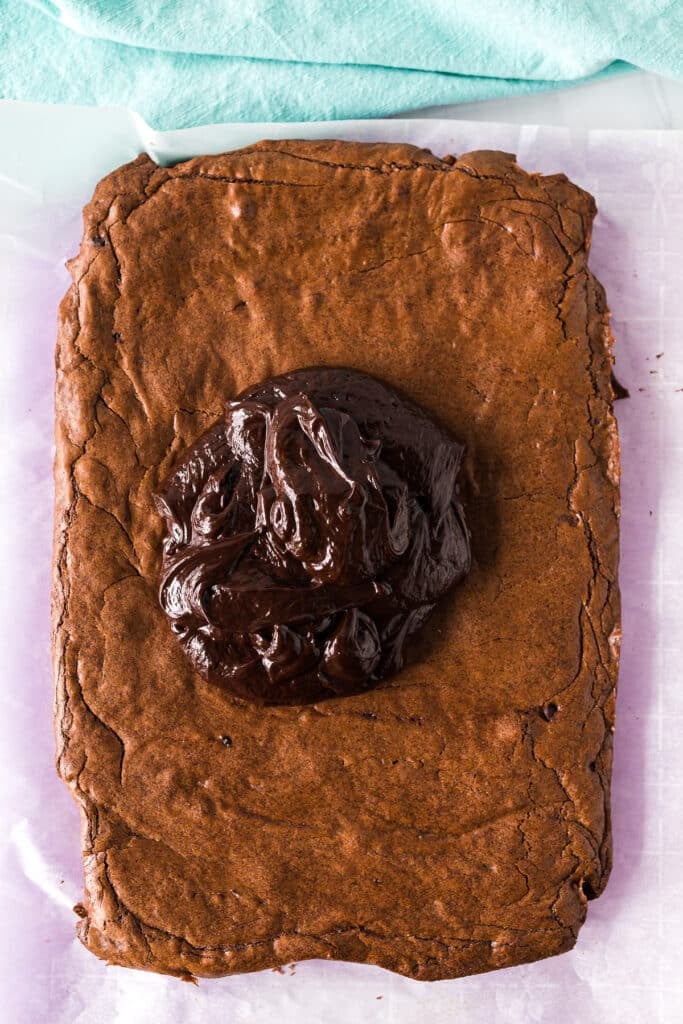 overhead shot of chocolate ganache on brownies.