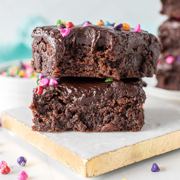 stack of two cosmic brownies with a bite missing from the top one.