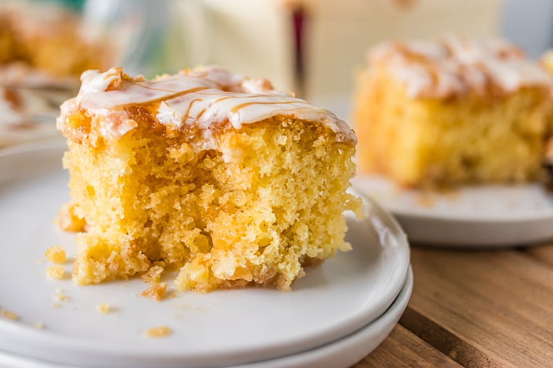 slice of cake with bite taken out on white plate