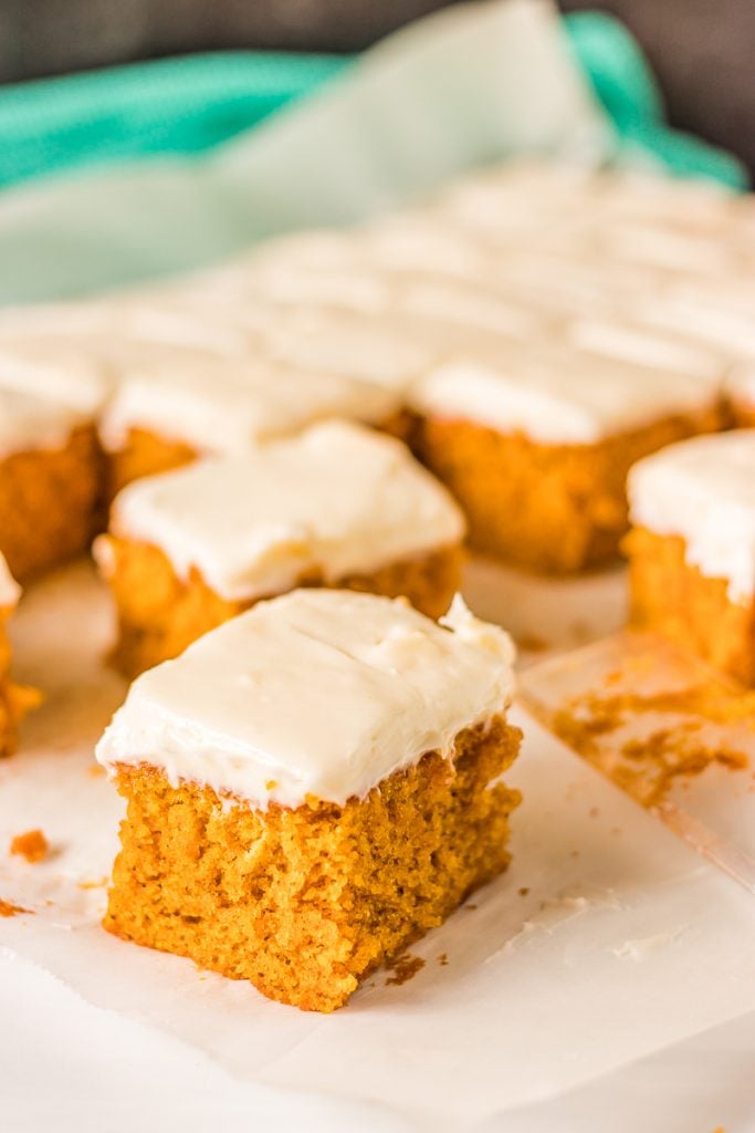 sliced pumpkin bars with thick cream cheese frosting