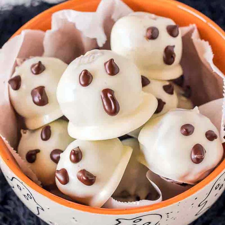 orange bowl filled with ghost oreo balls