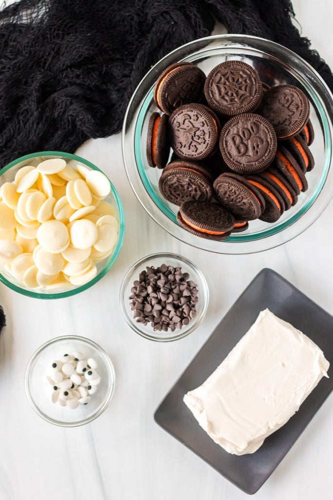 overhead shot of halloween oreos, cream cheese, and white chocolate wafers
