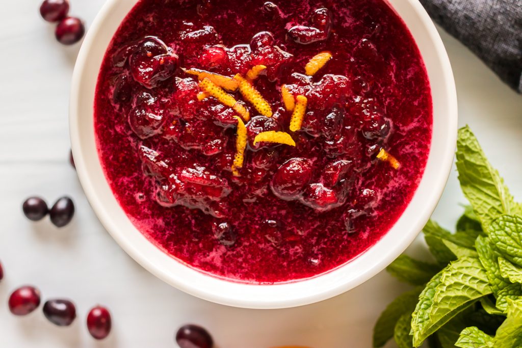 bowl of cranberry sauce garnished with orange zest