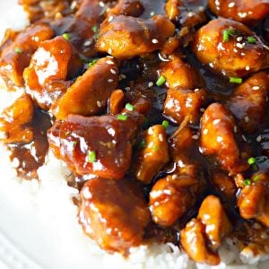 closeup of bourbon chicken over white rice
