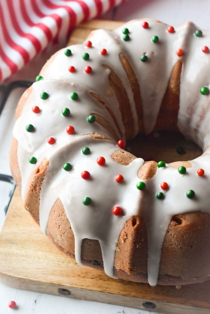 bundt cake topped with icing and red & green sprinkles