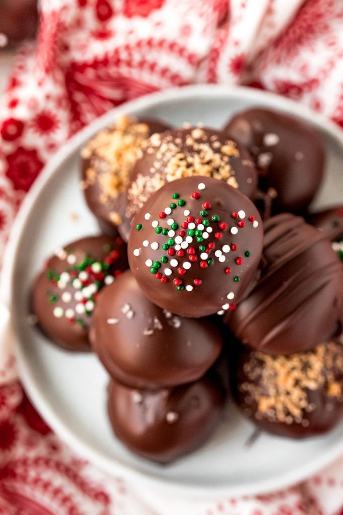 overhead shot of stack of nutter butter truffles sprinkled with christmas nonparelis