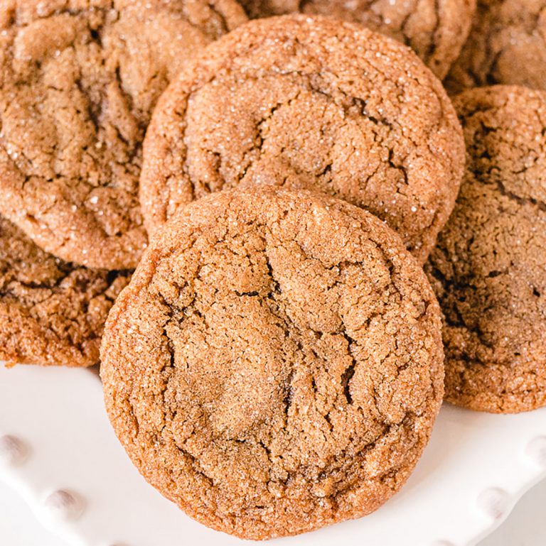 pile of molasses cookies on white platter