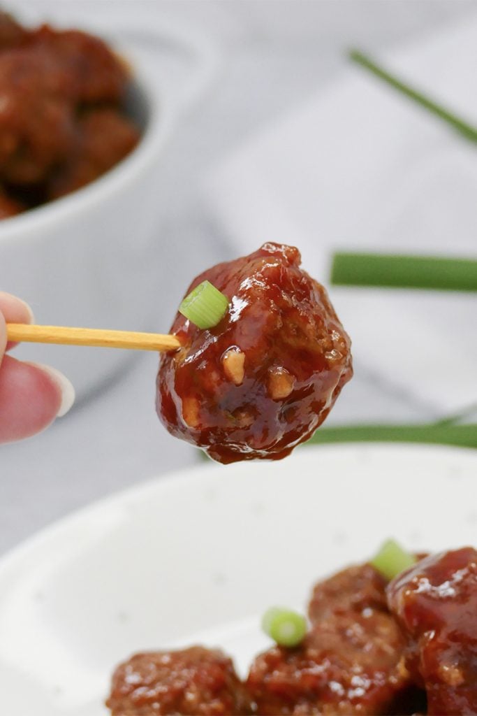 sweet & spicy slow cooker meatball on a toothpick