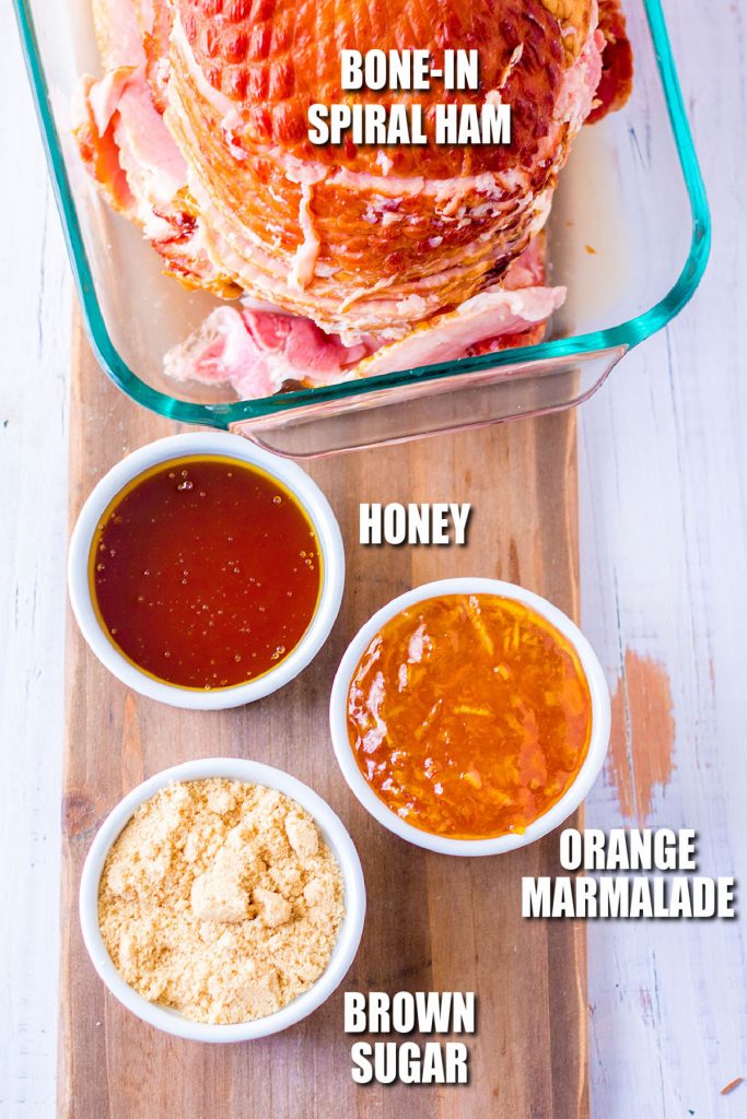 overhead shot of ham and ingredients to make orange honey glaze