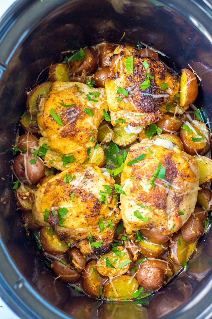 overhead shot of chicken and potatoes in slow cooker