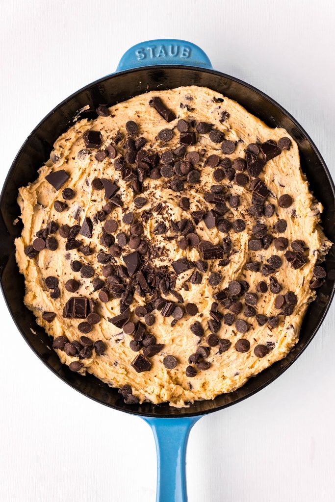 overhead shot of raw cookie dough in a skillet