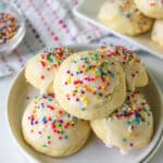 italian sugar cookies with rainbow sprinkles on a plate.