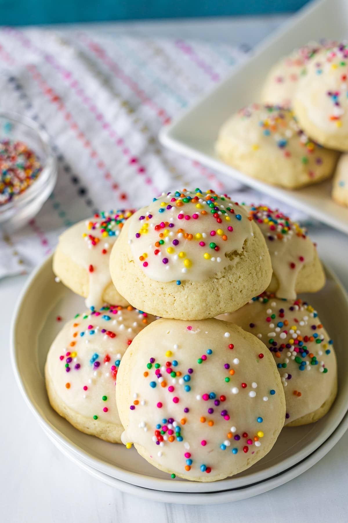 plate full of italian sprinkle cookies.