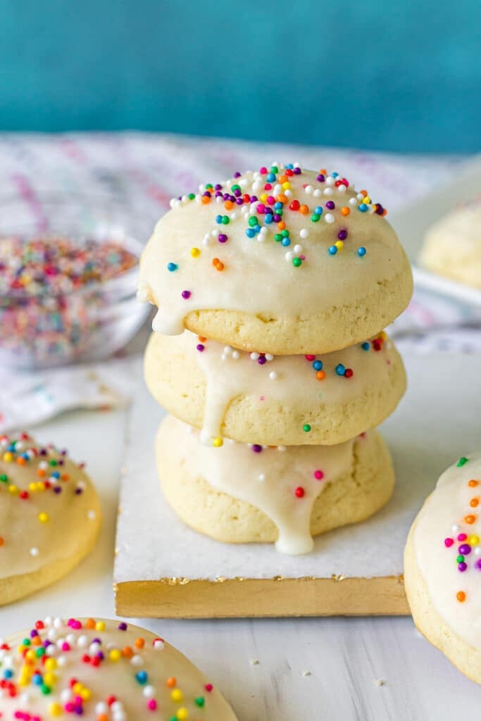stack of three italian sugar cookies with rainbow sprinkles.