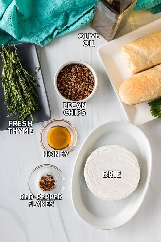 overhead shot of labeled ingredients laid out to make baked brie