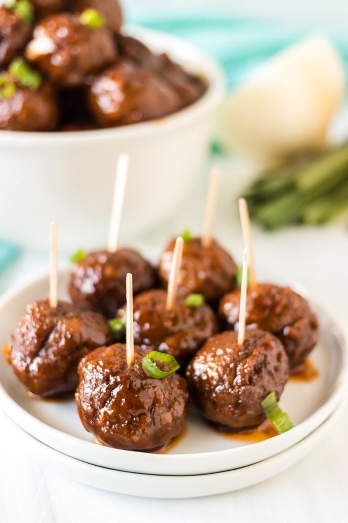 honey garlic meatballs with toothpicks stuck into them for serving as an appetizer