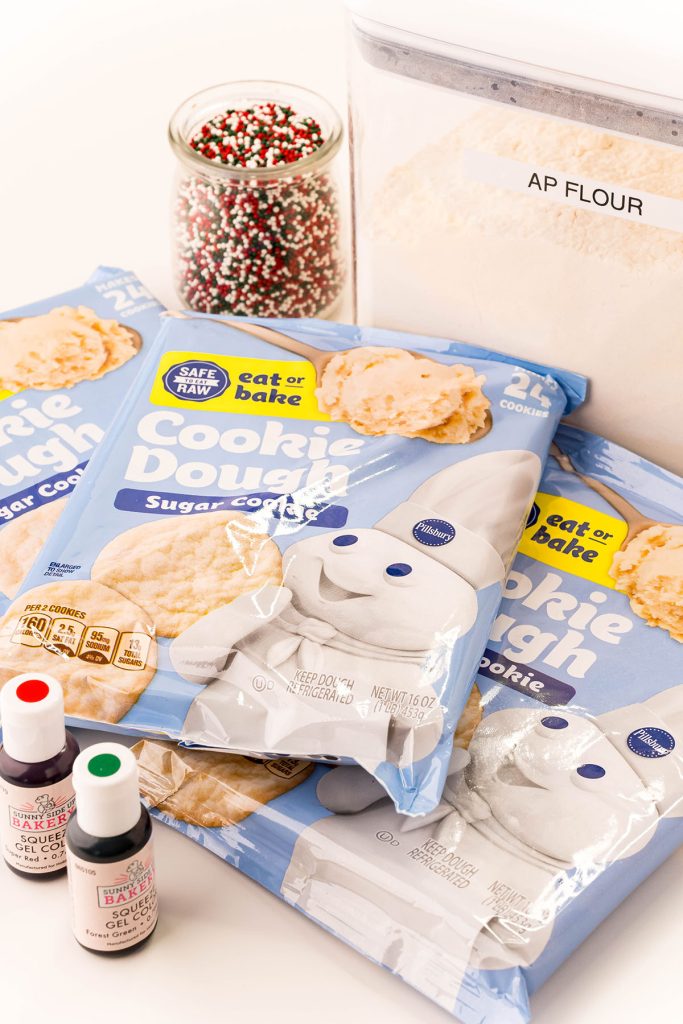 packaged cookie dough laid out to make christmas cookies