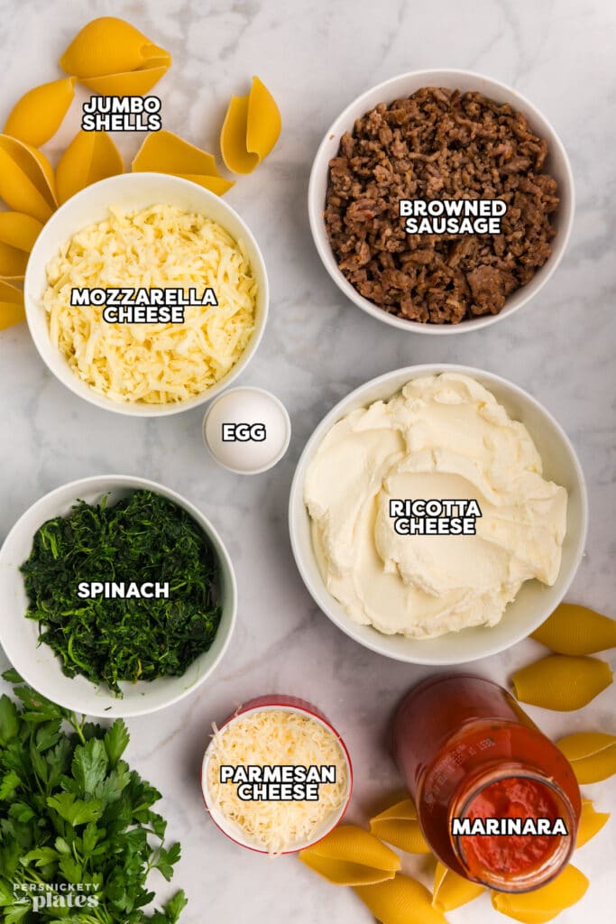 overhead shot of labeled ingredients laid out to make stuffed shells.