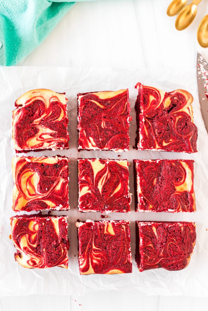 overhead shot of red velvet cheesecake brownies sliced into 9 brownies.