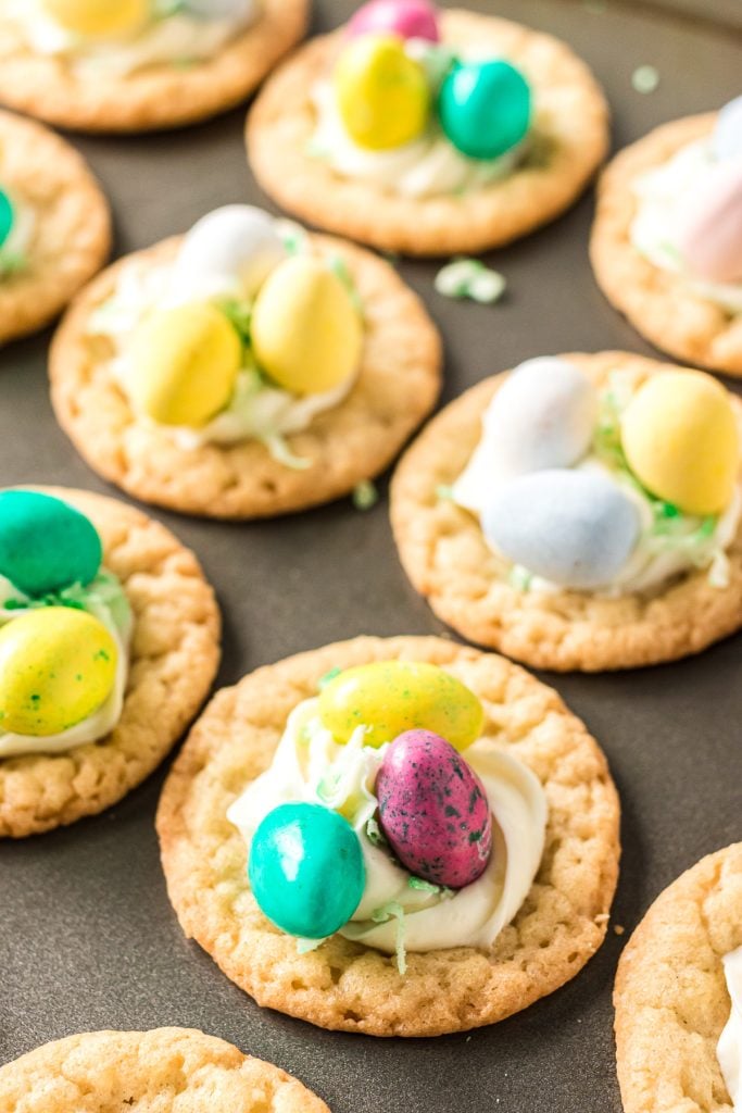cookie cups filled with cadbury mini eggs in a mini muffin pan.