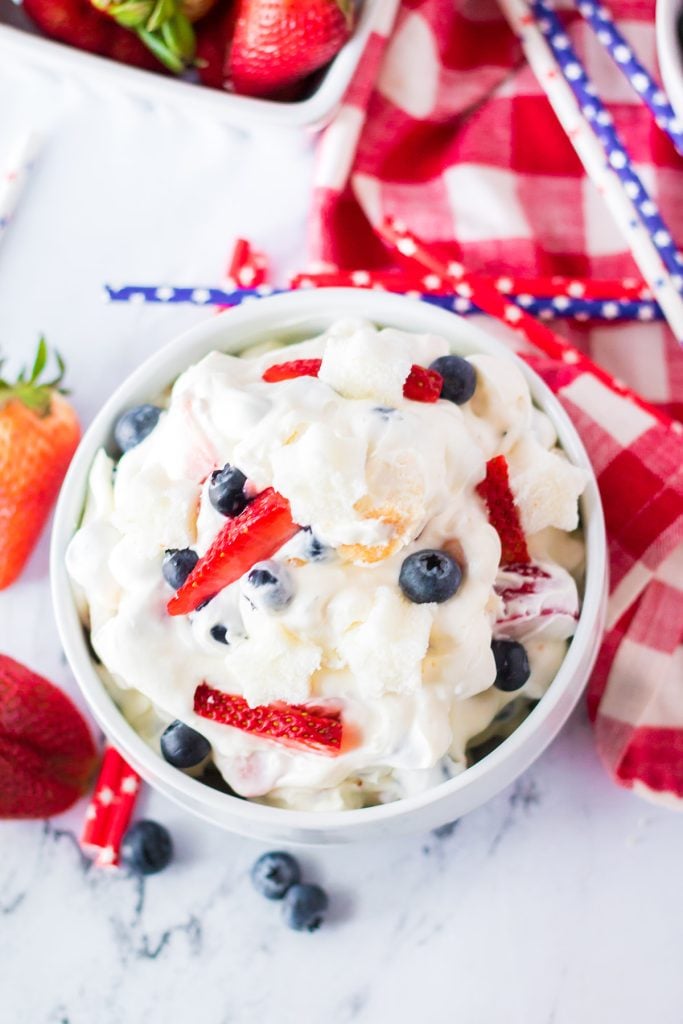 overhead shot of berry cheesecake fluff in a white bowl.