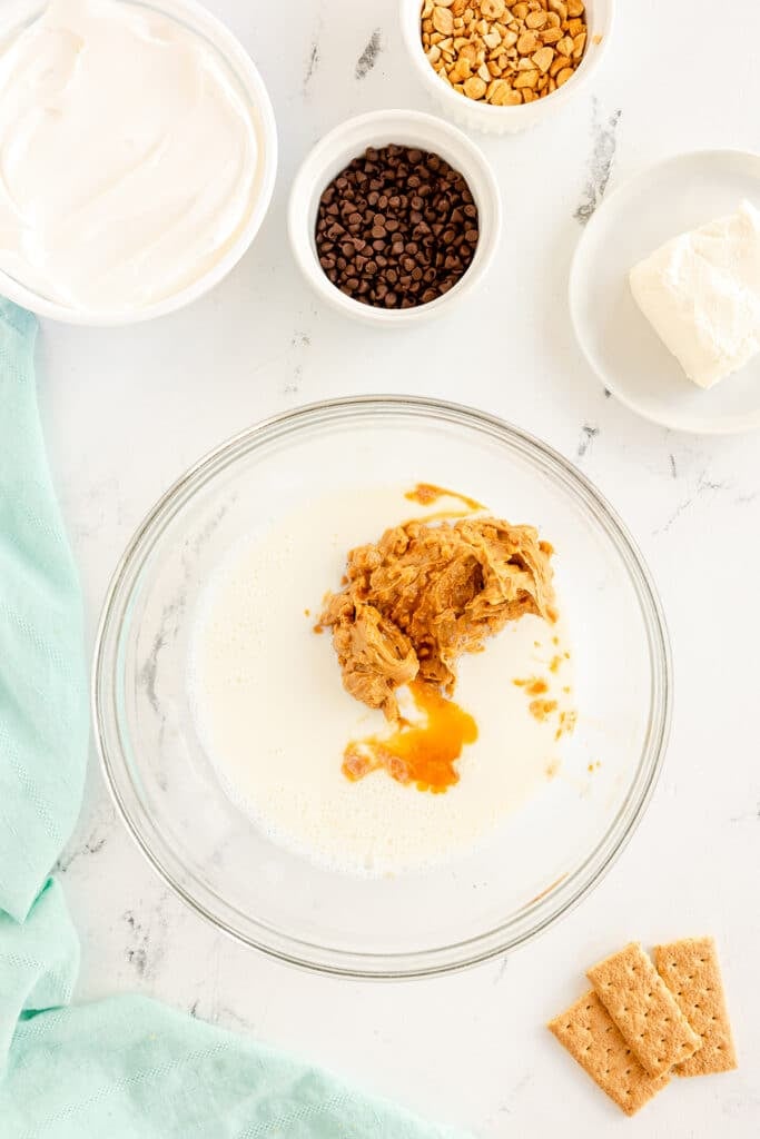 peanut butter in a mixing bowl with milk.