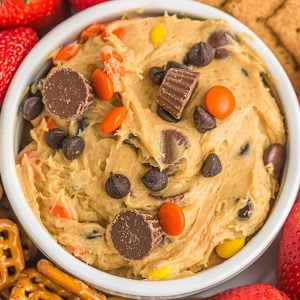 closeup overhead shot of peanut butter cup cookie dough dip topped with mini peanut butter cups.