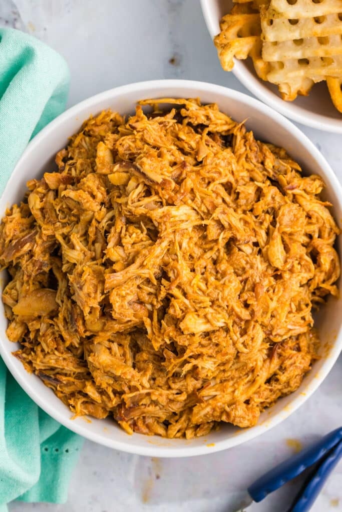 overhead shot of a bowl of shredded chicken.