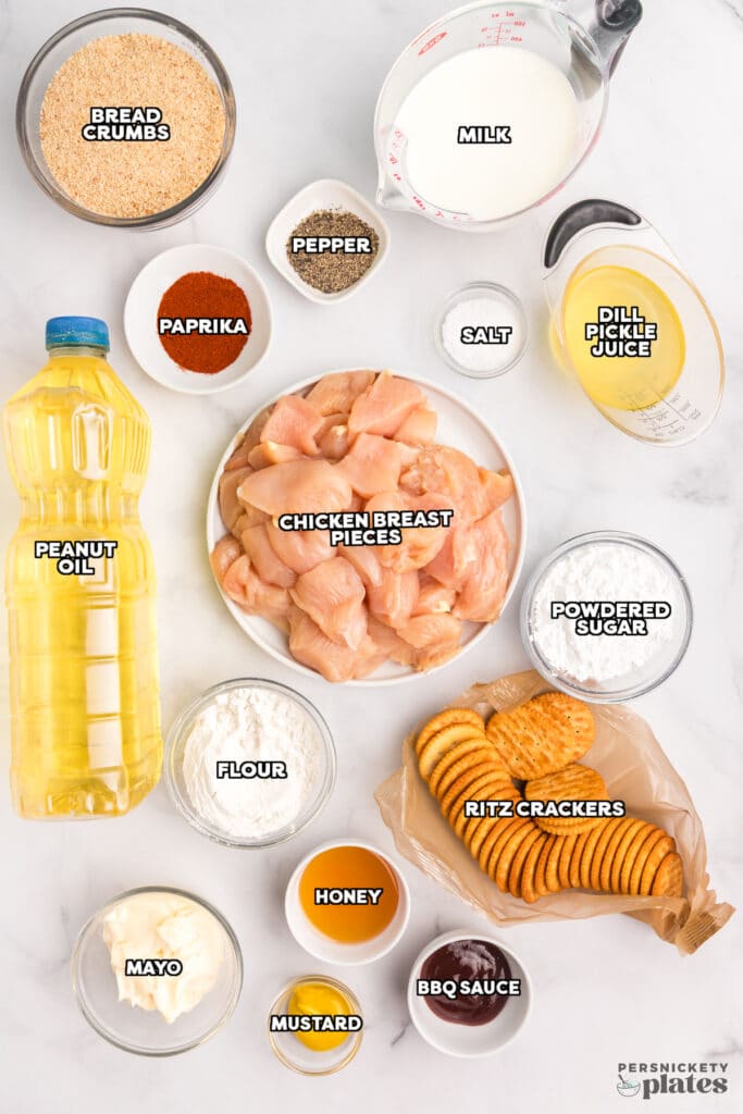 labeled ingredients laid out to make homemade chicken nuggets.