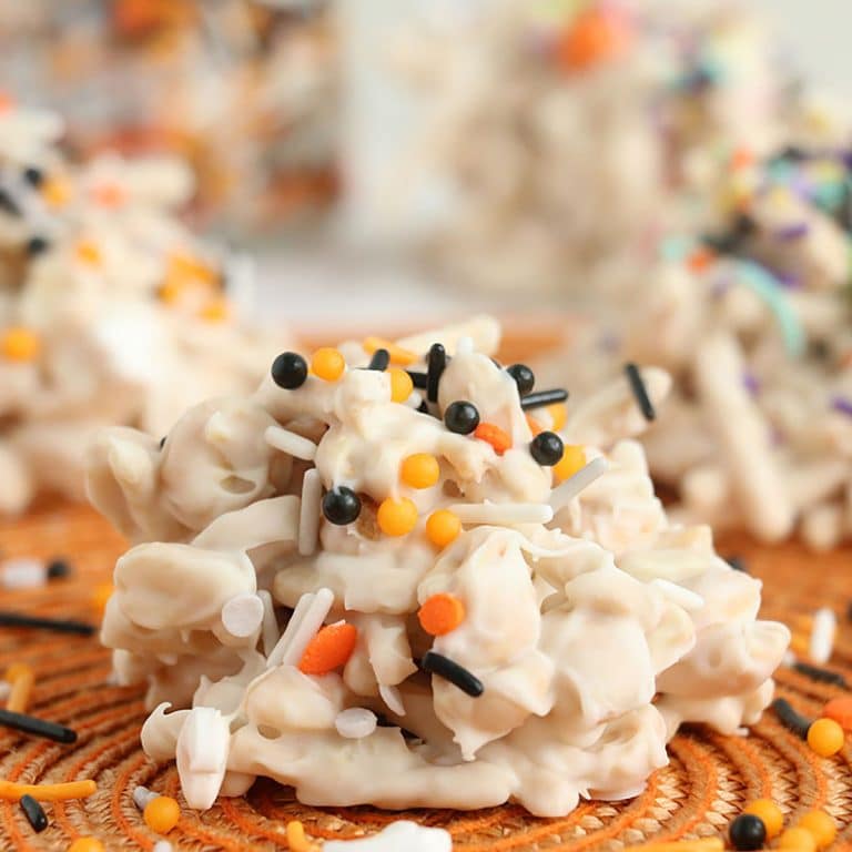 closeup of crockpot candy with halloween sprinkles.