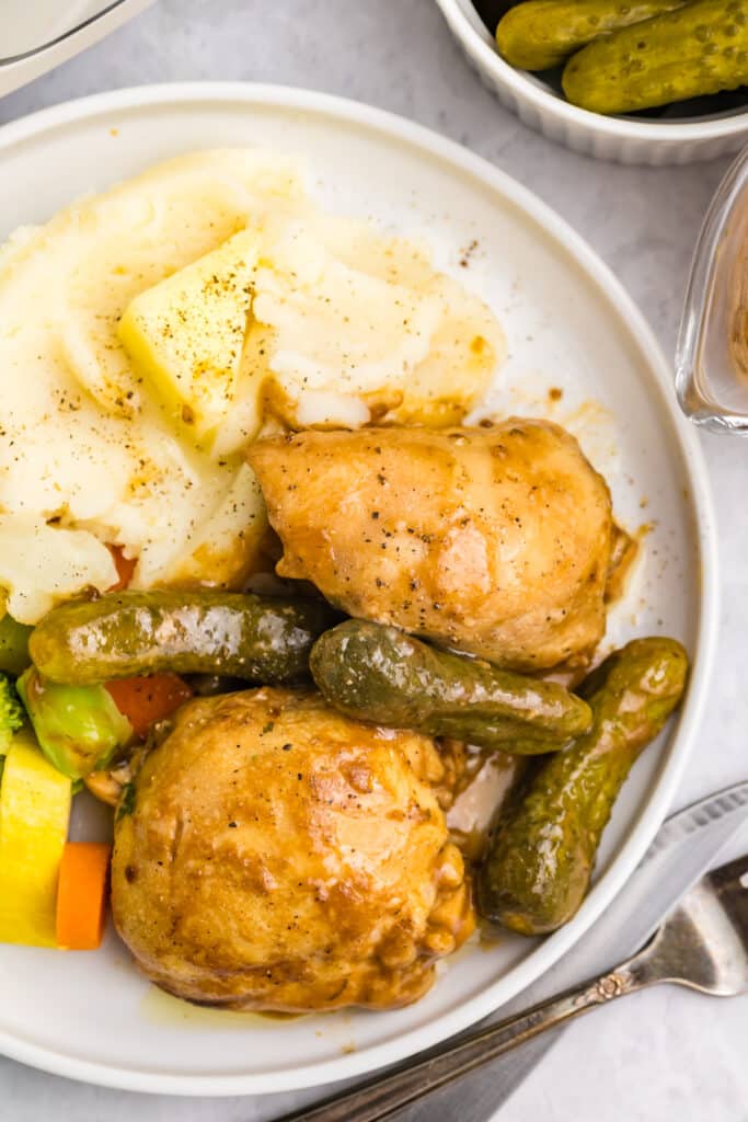 overhead shot of plate of pickle chicken with potatoes.