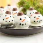 plate of oreo balls decorated as snowmen.