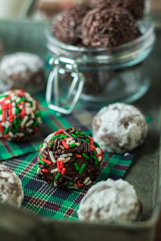 christmas rum balls on a plaid napkin.