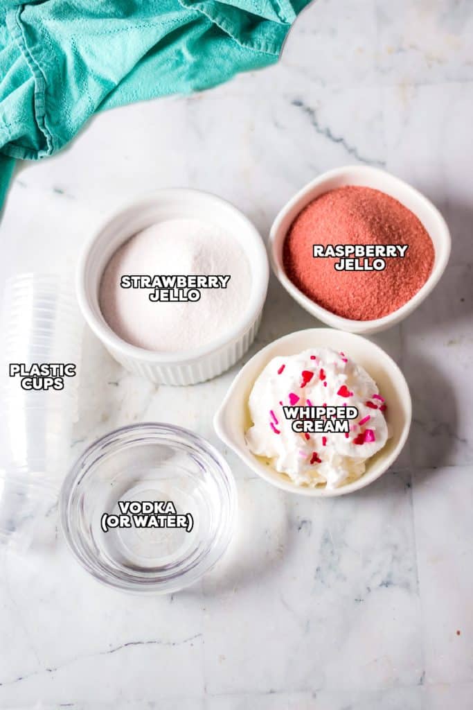 overhead shot of labeled ingredients laid out to make valentine jello shots.