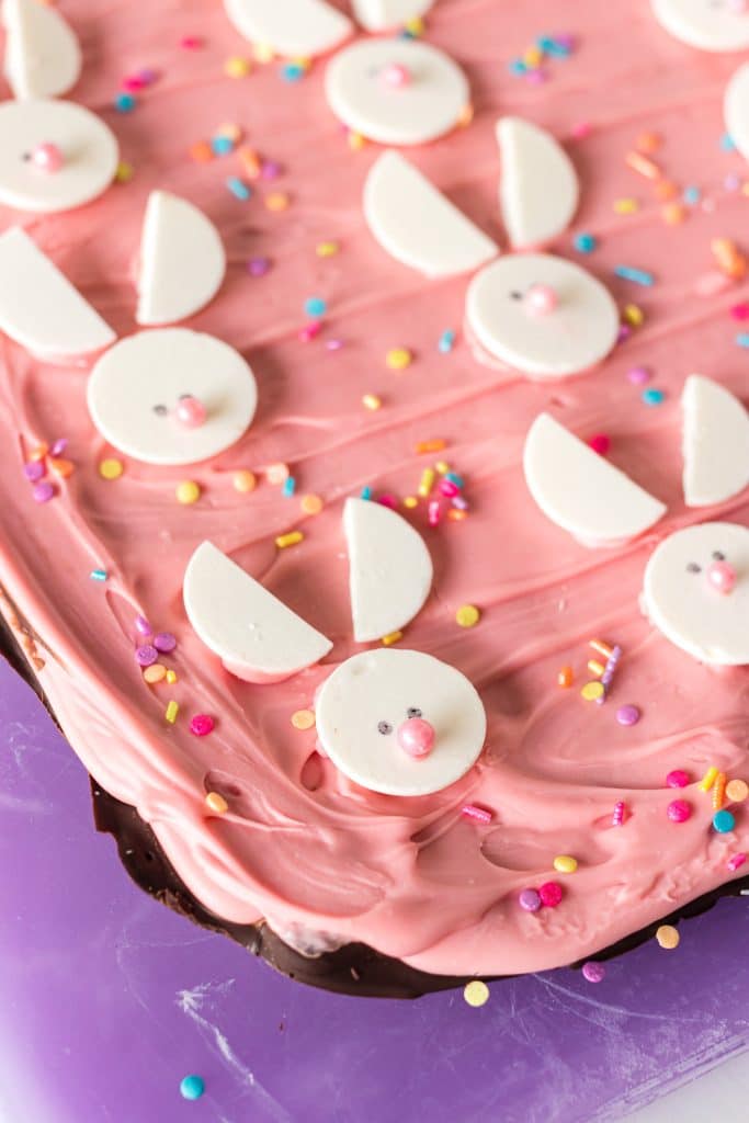 side view of layered easter bark topped with white chocolate bunnies.