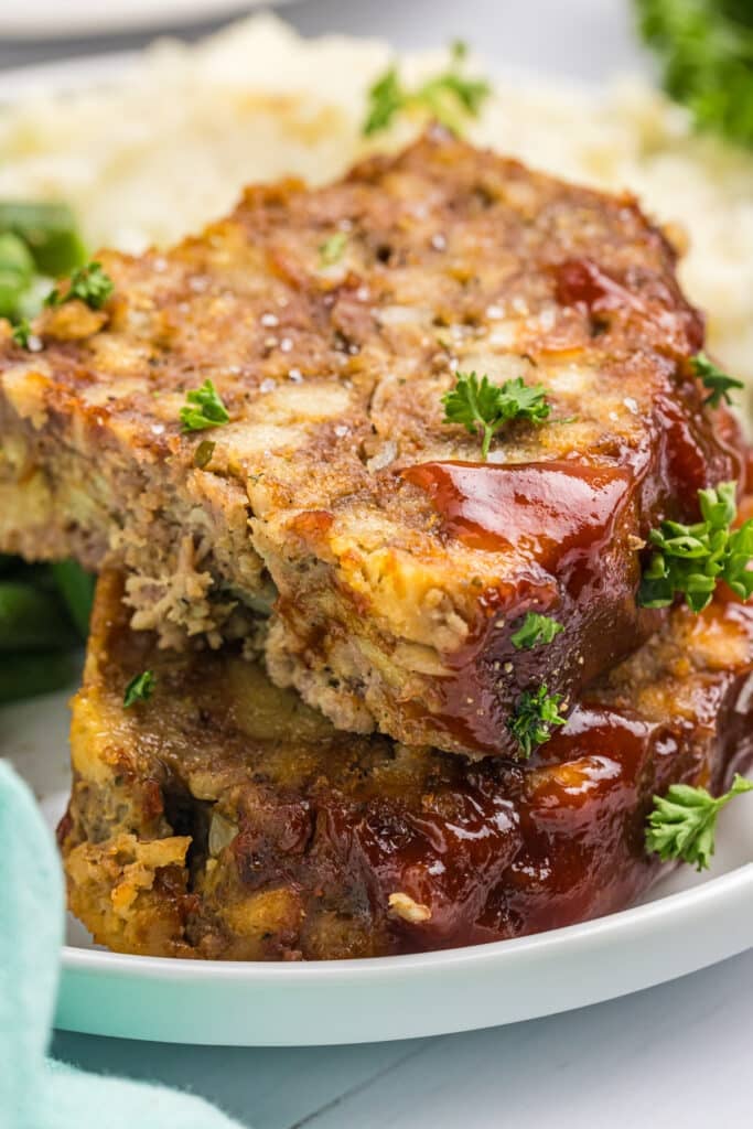 closeup of sliced meatloaf on a plate.