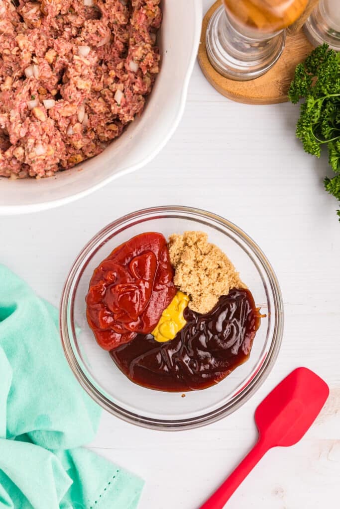 overhead shot of sauce mixture in a glass mixing bowl.