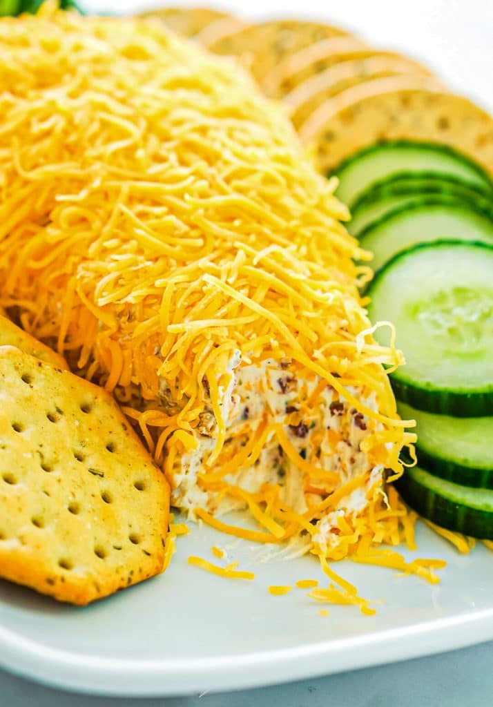 cheese ball with crackers & cucumbers.