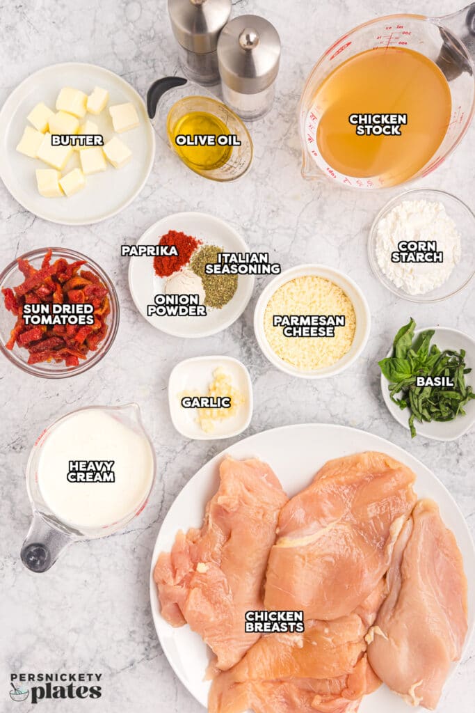 overhead shot of labeled ingredient laid out to make marry me chicken in a crockpot.