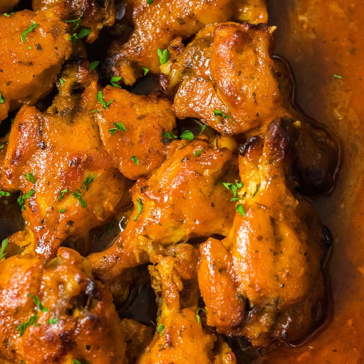 closeup of buffalo ranch chicken wings in a crockpot.