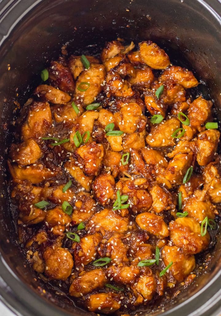 overhead shot of orange chicken in a slow cooker.